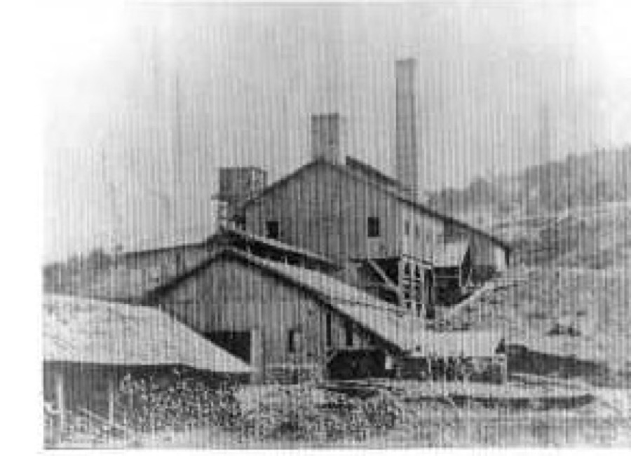 The Cahaba Iron Works, better known as the Irondale Furnace, photographed from the southwest around 1870. The stack and its wooden casting shed sit against the cut hillside on Furnace Creek. One of only four known photographs of the operating furnace.
