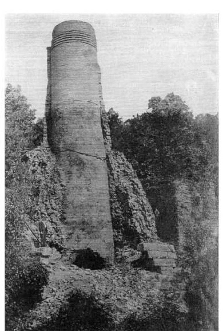 The Irondale Furnace stack in 1893, twenty years after the last blast. The brick-lined top rises out of the stone base, already going back to the woods. Published in Joseph H. Woodward's Alabama Blast Furnaces. The ruin still stands on the Furnace Creek trail today.