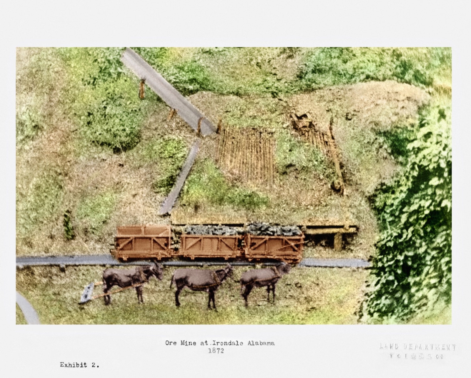 Ore cars and mule teams at one of the Irondale ore mines, photographed in 1872. This is the working east of here, near today's Eastwood Festival Center. Loaded cars ran down to the furnace by gravity while the mules brought the empties back up. Original photograph in the Crawford Collection at Samford University; colorized and restored by Todd Russell.